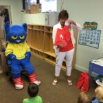 Special guest Pete the Cat and Joan Whitson, ELC of North Florida Outreach Manager, read books from the book bag project to the children at Miss Kate’s Preschool in Fernandina Beach.